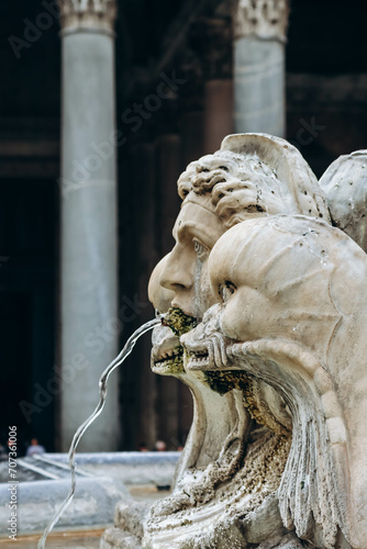 Details of a fountain in Rome near the Pantheon on a cloudy December day photo