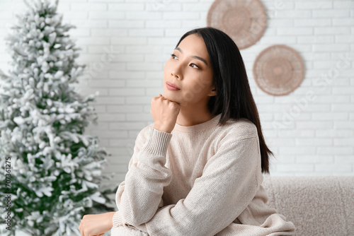 Portrait of thoughtful youn...