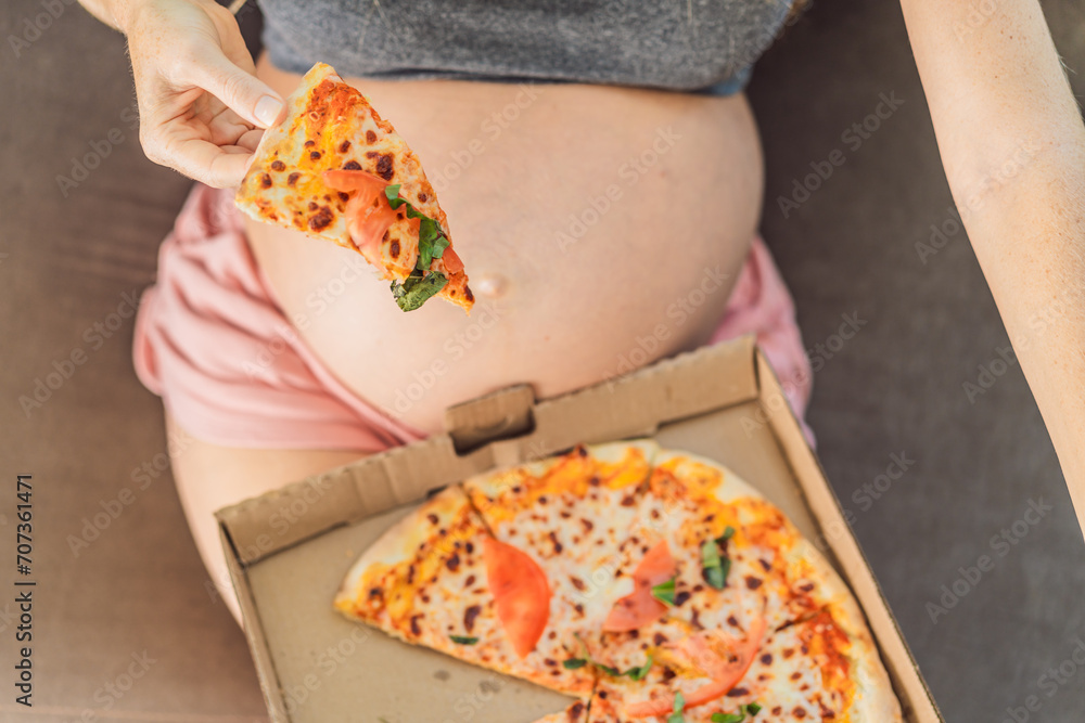 Αυτοκόλλητο A pregnant woman enjoys a slice of pizza, savoring a moment of indulgence while satisfying her craving for a delightful, comforting treat