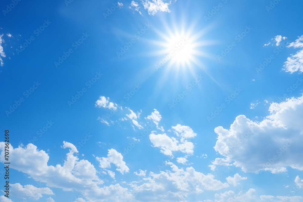 beautiful blue sky with white cumulus clouds and sun for abstract background