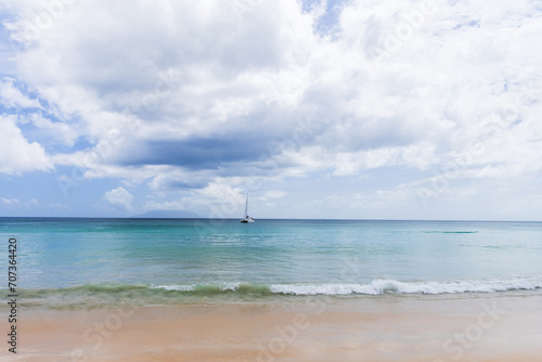 Landscape photo of Beau Vallon beach taken on a sunny day. Mahe, Seychelles