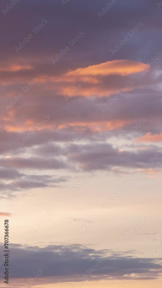 Colorful clouds moving fast in time-lapse. Idyllic cloudy heaven background. Vertical timelapse of beautiful clouds in sky in evening sunlight, Sunset, multicolored clouds in motion
Colorful clouds moving fast in time-lapse. Idyllic cloudy heaven background. Vertical timelapse of beautiful clouds in sky in evening sunlight, Sunset, multicolored clouds in motion