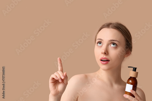 Young woman holding cosmeti...