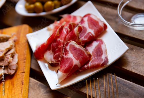 Delicious cut pieces dry-cured pork neck. Traditional Spanish meat products