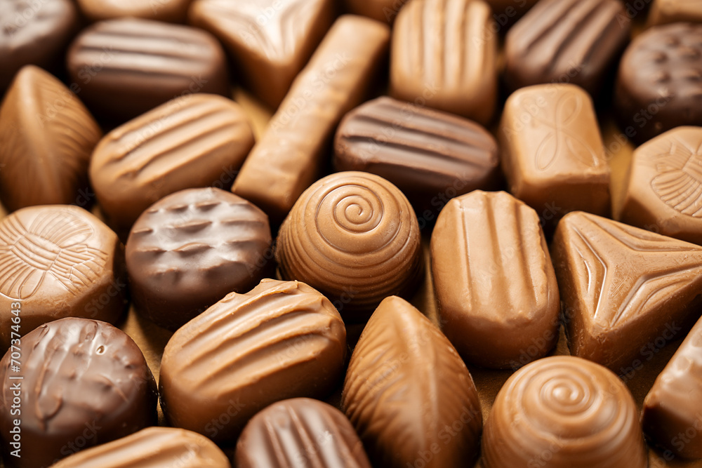 Chocolate candies close-up, pralines, truffles. Abstract chocolate background Chocolate candies close-up, pralines, truffles. Abstract chocolate background