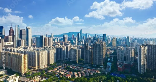 Aerial forward shot of guangzhou city skyline and nature scenery photo