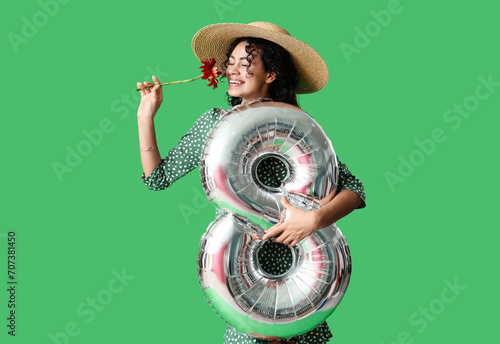 Happy young woman in straw ...