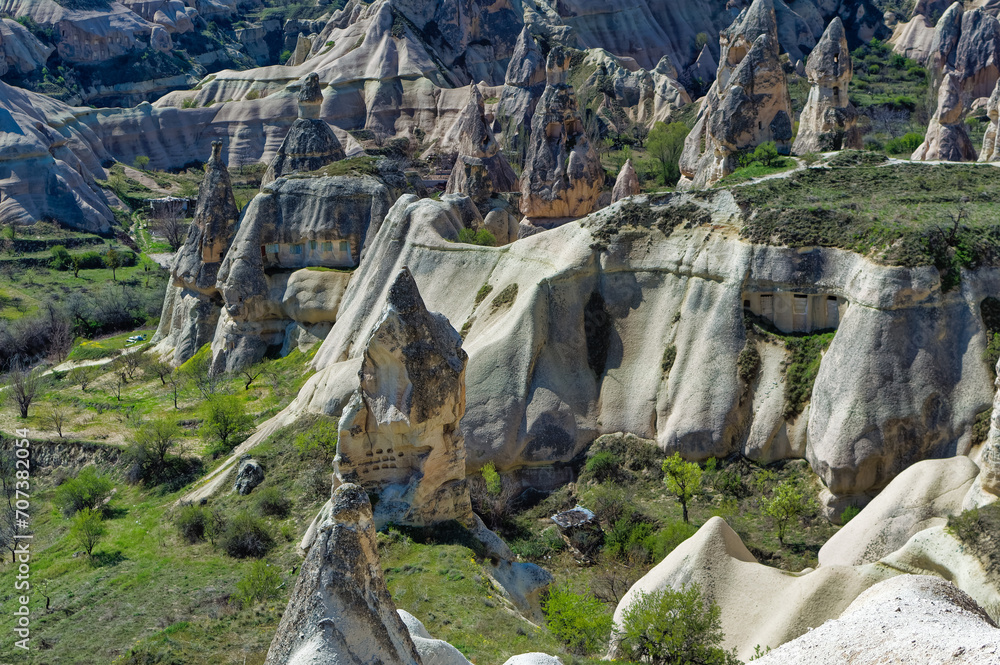 Cappadocia landscape soft volcanic rock, shaped by erosion into towers.
