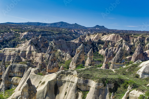 Cappadocia landscape soft volcanic rock, shaped by erosion into towers.