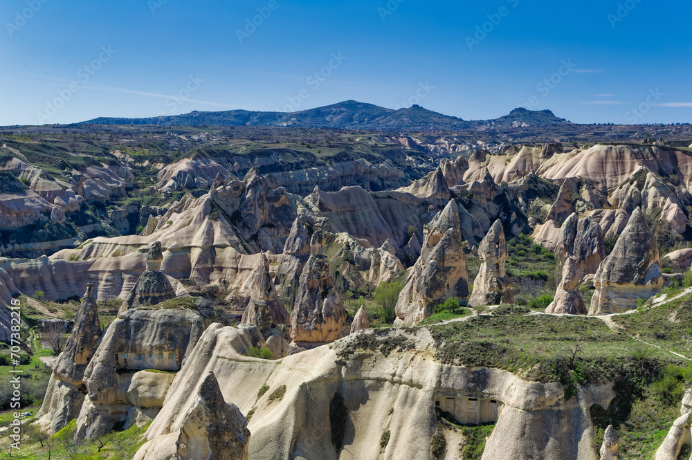 Cappadocia landscape soft volcanic rock, shaped by erosion into towers.