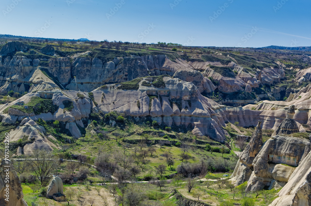 Cappadocia landscape soft volcanic rock, shaped by erosion into towers.