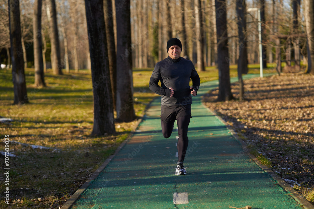 Senior athlete running in the park Senior athlete running in the park