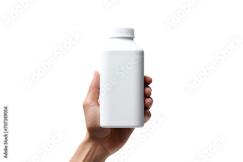 a hand holding a white bottle photo