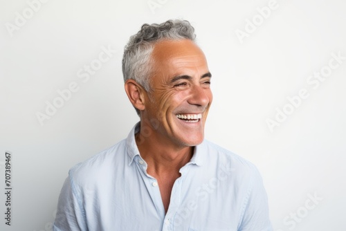 Portrait of happy senior man smiling. Isolated on white background.