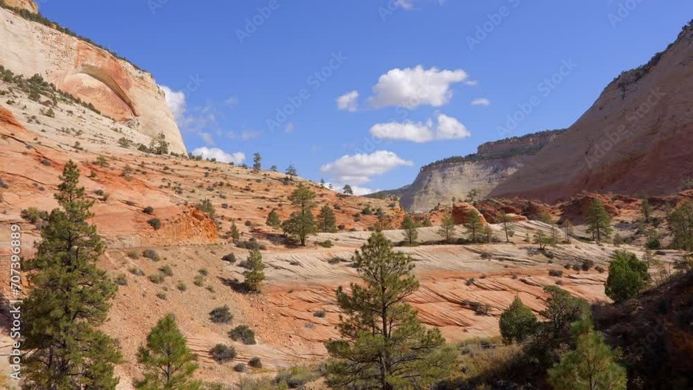 Establishing shot of mountains with red rocks in Zion Mount Carmel Highway, Zion National Park, Utah, North America. Day time. ProRes 422 HQ. Establishing shot of mountains with red rocks in Zion Mount Carmel Highway, Zion National Park, Utah, North America. Day time. ProRes 422 HQ.