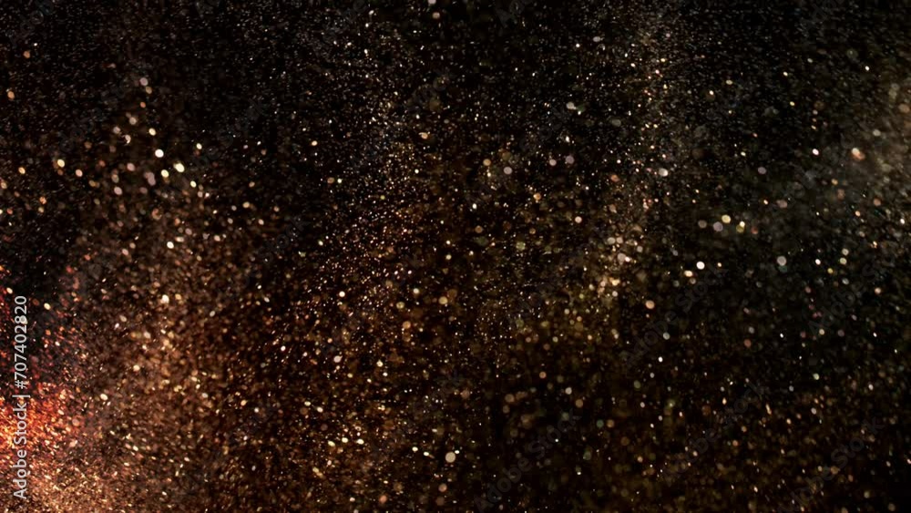 Super Slow Motion Shot of Festive Golden Glittering Background at 1000fps. Super Slow Motion Shot of Festive Golden Glittering Background at 1000fps.