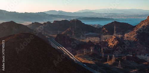 Hoover Dam on the Colorado River straddling Nevada and Arizona at dawn from above. Aerial view of Hoover Dam and the Colorado River Bridge photo