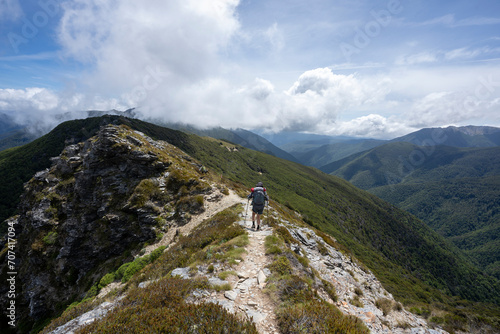 Hiking in the mountains of New Zealand featuring scenic landscape, blue sky and clouds © Daniel Thomas