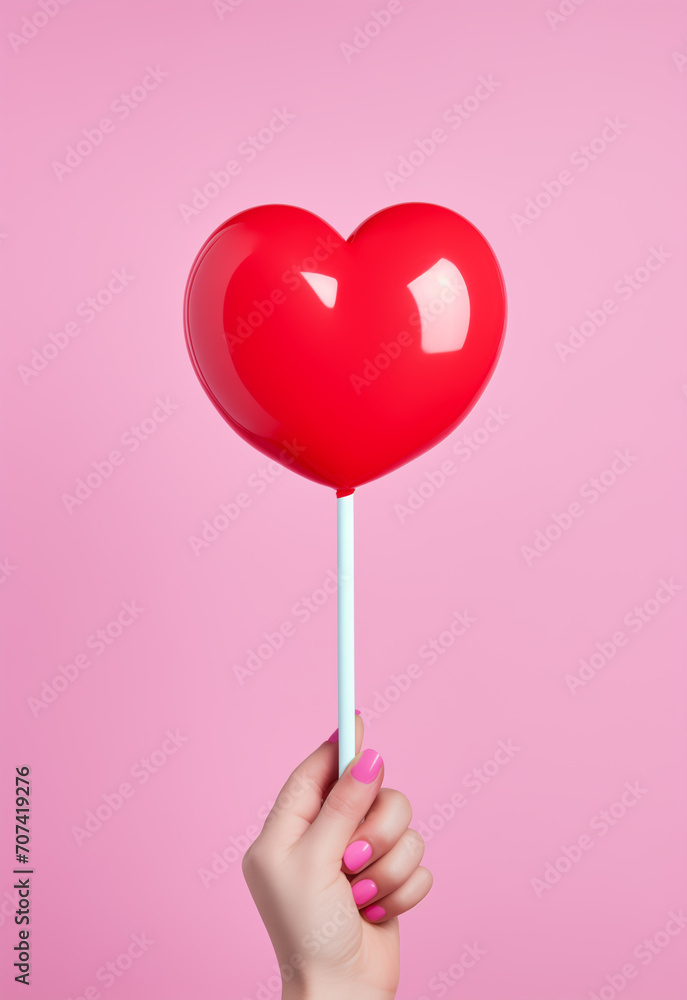 valentine - lollipop in the shape of a red heart in hand in pop art style, minimalism