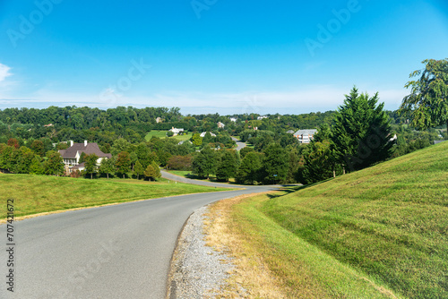 View from the hill to the valley with rich detached houses of the highest class.
