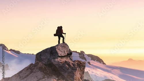 Adventure Woman on top of Rocky Mountain Cliff. Aerial Canadian Mountain landscape from British Columbia in Background. 3d Rendering Peak. photo