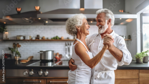A delightful elderly couple dancing in the kitchen amidst culinary creations, copy space  photo
