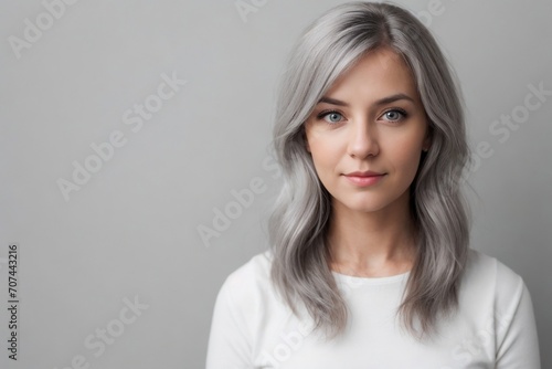 Portrait of an aged woman with beautiful young skin standing against a white background with copy space. Anti-aging  Skincare treatment  and Cosmetic concept.