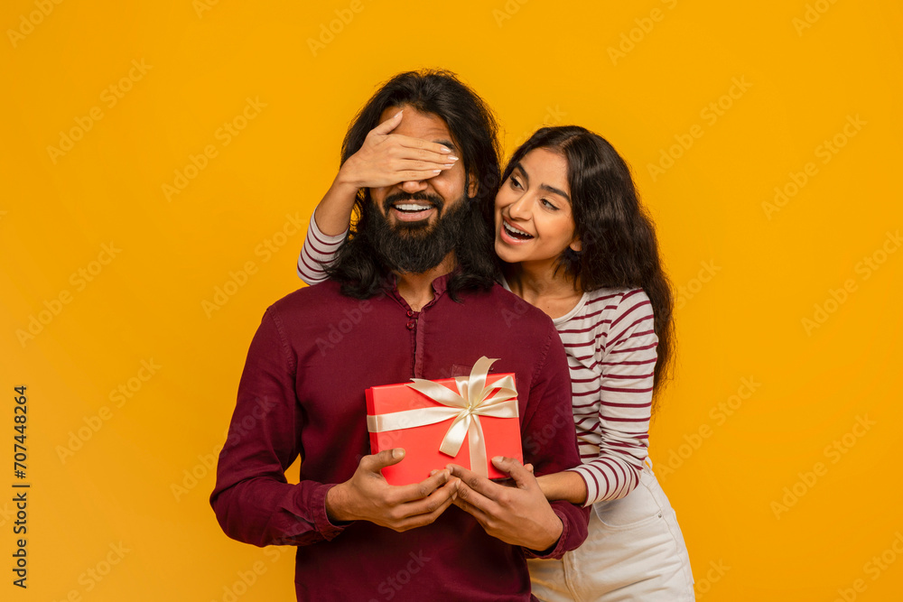 Loving young indian woman make surprise for her husband Loving young indian woman make surprise for her husband