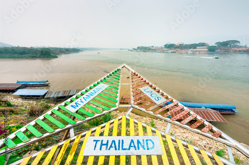 Golden Triangle sign,giving directions for visitors,overlooking the Mekong River,Chiang Rai Province,Northern Thailand.