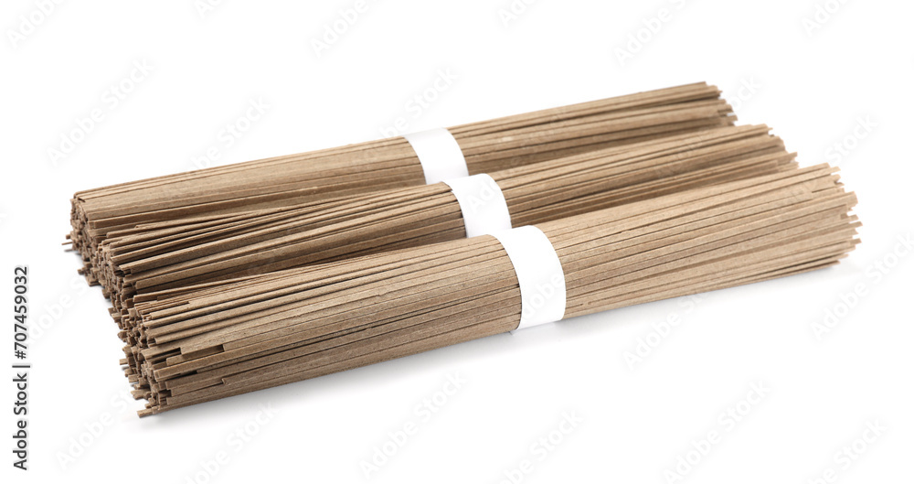 Uncooked buckwheat noodles (soba) isolated on white Uncooked buckwheat noodles (soba) isolated on white