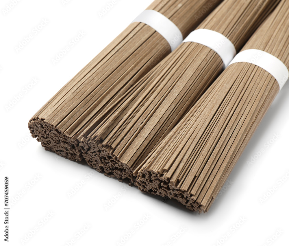 Uncooked buckwheat noodles (soba) isolated on white Uncooked buckwheat noodles (soba) isolated on white