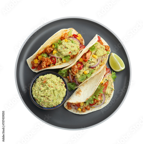 Delicious tacos with guacamole, meat, vegetables and slice of lime isolated on white, top view