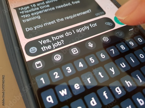 A person replying to a job offer message