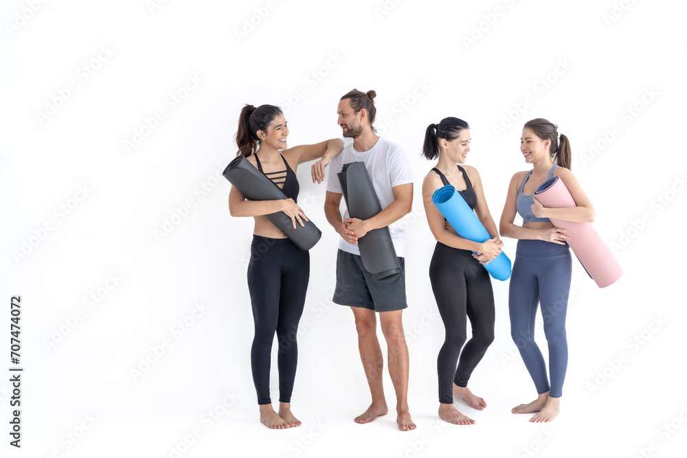 Group of happy sporty girls and guy wearing body stylish sportswear holding personal carpets leaned on a white background. waiting for yoga class or body weight class. healthy lifestyle and wellness Group of happy sporty girls and guy wearing body stylish sportswear holding personal carpets leaned on a white background. waiting for yoga class or body weight class. healthy lifestyle and wellness
