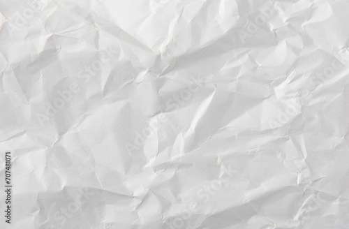 crumpled white paper texture background. photo