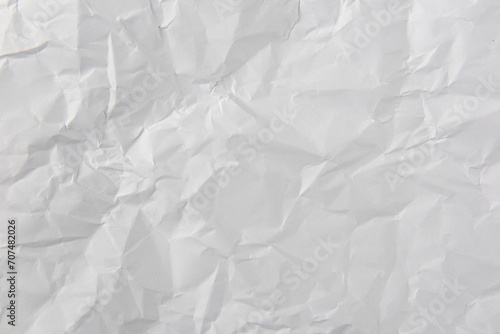 crumpled white paper texture background. photo