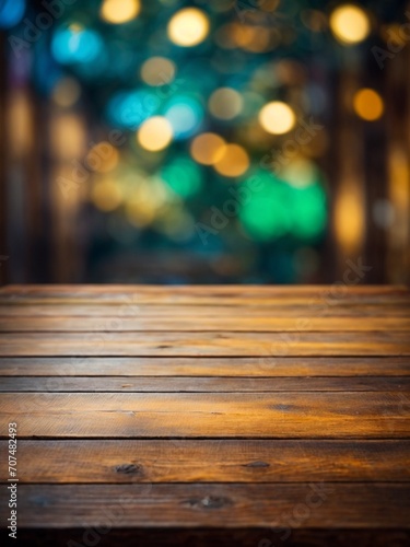 Wallpaper background with bokeh lightings and empty wooden table for product ads display 