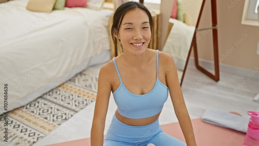 Fun and crazy! young chinese woman's comical fish face expression, making you laugh in her bedroom Fun and crazy! young chinese woman's comical fish face expression, making you laugh in her bedroom