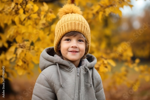 Portrait of happy kid boy with autumn outdoors