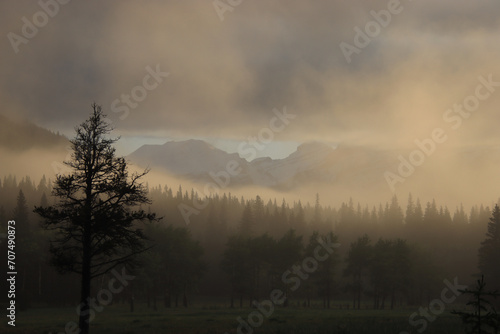 Mountain through Golden Fog and Low Clouds