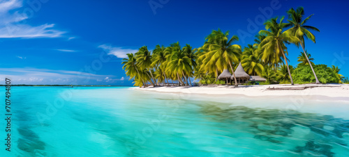 Idyllic palm-fringed beach hut on a sun-kissed tropical isle © thodonal