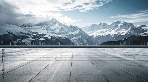 Square concrete floor with amazing winter snow mountain landscape