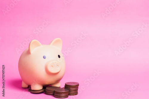 pink bank with coins. piggy bank on pink background