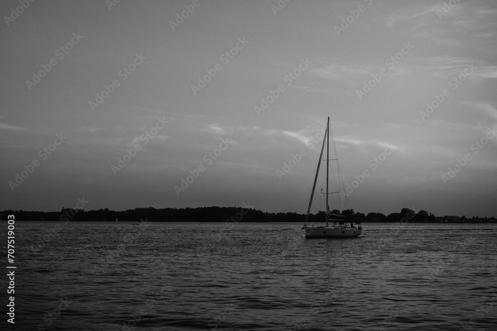 Sailboat at sunset in black and white