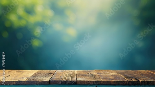 Wood table top on blue abstract green from garden in the morning background.For montage product display or design key