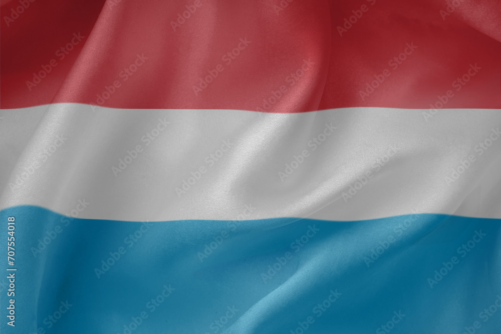 Luxembourg  waving flag close up fabric texture background