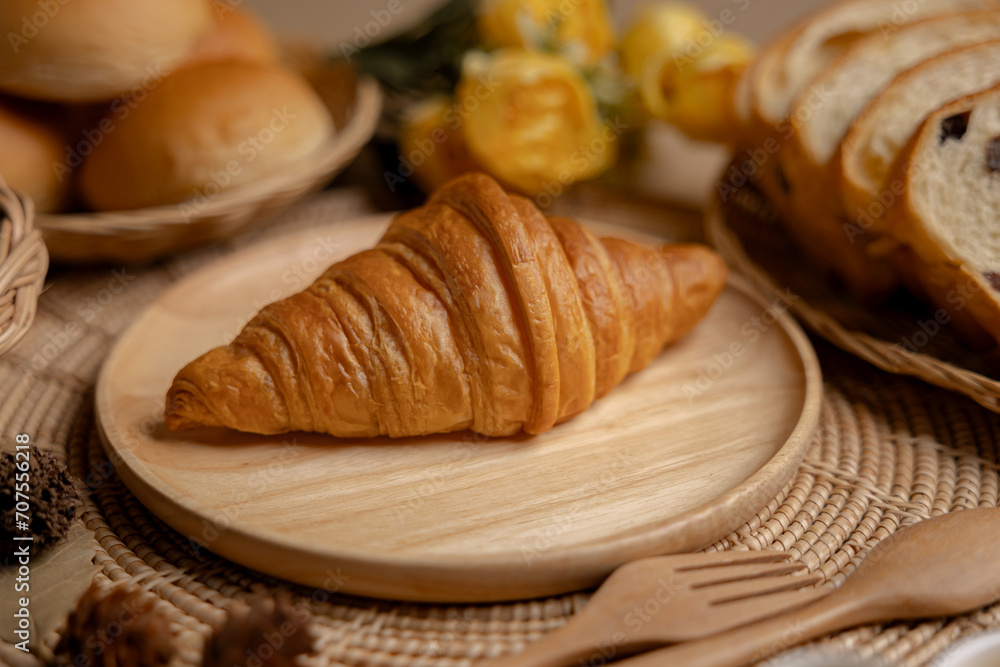 Croissants on a wooden plate