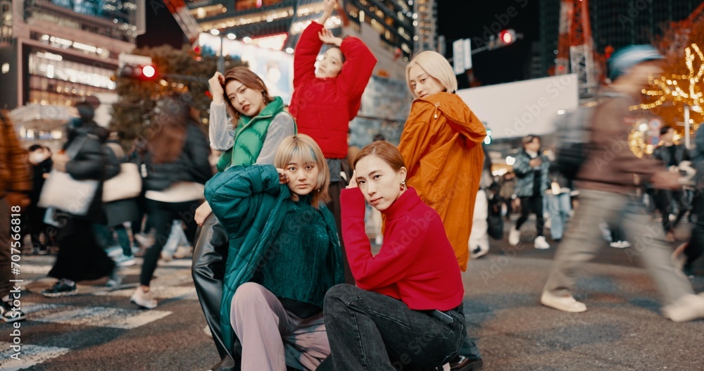City, urban fashion and Japanese friends with gen z, youth culture and streetwear style outdoor in Japan with group. Young people, travel and road with teen clothing, women and together in town
