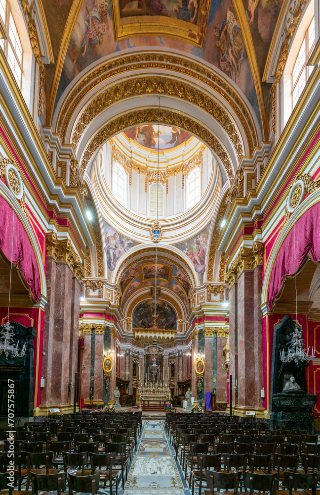 view of the central nave and altar in the Metropolitan Cathedral of St. Paul in Mdina