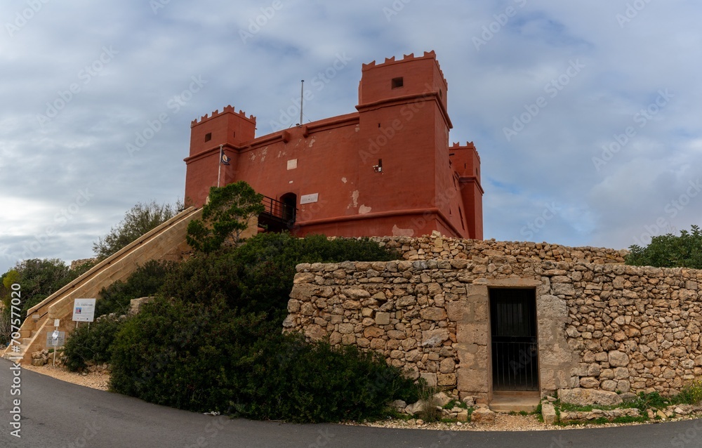 view of the landmark fortress and historic Saint Agatha's Tower in Malta under an overcast sky view of the landmark fortress and historic Saint Agatha's Tower in Malta under an overcast sky